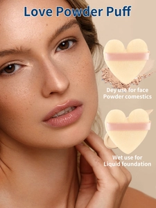 Beige heart-shaped makeup puff with pink strap for wet and dry foundation application