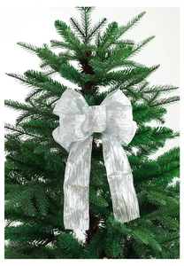 Close-up of a large silver Christmas glitter bow with wired edges on a green tree