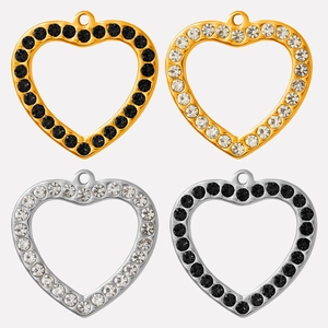 Detailed view of heart-shaped hollow pendants with crystals in gold and silver finishes