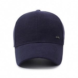 Classic navy blue men's baseball cap with textured fabric and metallic side emblem