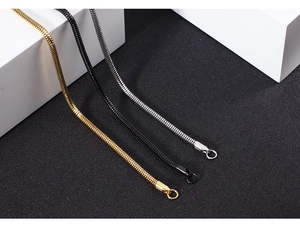 Detail of metal snake chains in gold, black, and silver finishes for DIY jewelry making