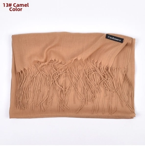 Detailed view of camel cashmere scarf featuring fine tassel edges and 13# color finish