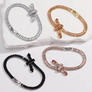 Detailed macro of four-color zircon tennis bracelets on natural white stone texture