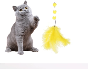 Cat teaser toy detail with yellow feathers and plush balls shown with grey cat