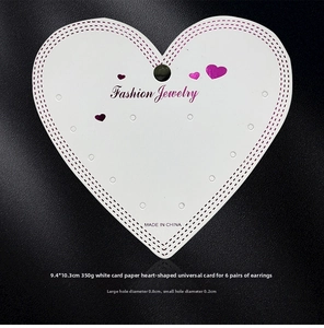 Close-up of heart-shaped jewelry display card with pre-punched earring holes