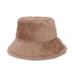 Close-up of the fluffy brown faux fur texture on a warm winter bucket hat for women