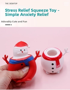 Macro detail of Santa Claus squeeze cup toy and white snowman stress relief figure