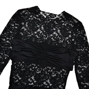 Detail of floral lace texture and pleated bodice on this black long sleeve slim dress