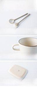 Detail of ergonomic hollow handle and anti-slip matte base of ceramic coffee mug