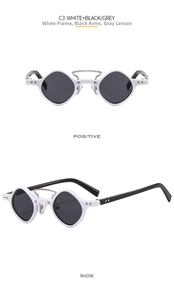 Detail view of retro geometric white frame sunglasses with black temples and grey lenses