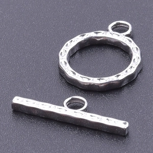 Detailed close-up of 18k gold plated stainless steel OT toggle clasp with hammer texture