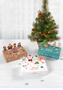 Detailed view of Christmas favor boxes with 3D cartoon animal lids and festive patterns
