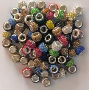 Macro view of multi-colored sparkling crystal clay bead assortment for jewelry making