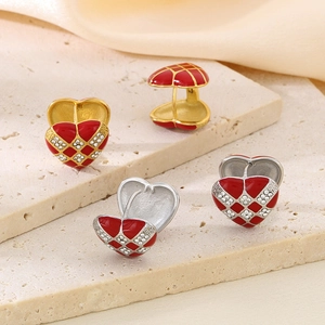 Checkered red heart earrings with white diamonds and gold-tone finish on stone