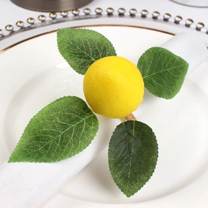 Detailed view of lifelike lemon napkin ring with green leaves on elegant tableware