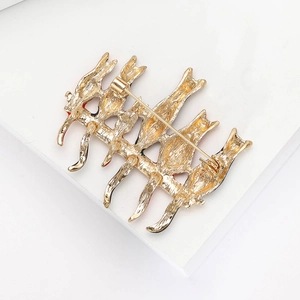Detailed back view of golden cat brooch showing secure metal safety pin clasp mechanism
