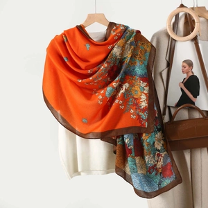 Lightweight orange scarf with retro floral print and smooth texture for women