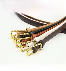 Detailed view of five slim PU leather belts for women with twisted gold metal buckles