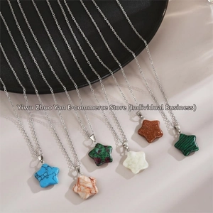 Macro detail of various star-shaped natural stone pendants on silver S925 chains