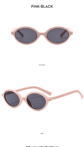 Pink oval vintage sunglasses with dark grey lenses and gold metal temple accents