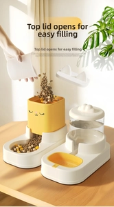 Detail of pet feeder with top-loading grain lid and dual bowl system for cats