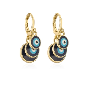 Close-up of stacked gold-plated evil eye earrings with colorful enamel glaze detail