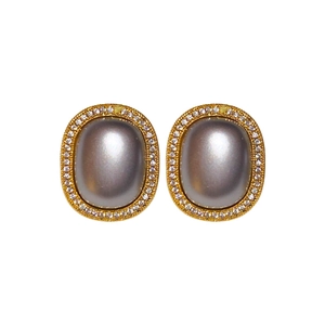 Elegant gold oval earrings featuring central grey pearls and sparkling zircon halo