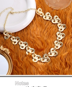 Vintage golden woven metal necklace with extension chain and lobster clasp on fur background