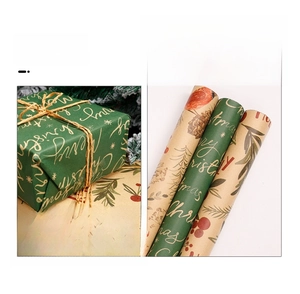 Detail of kraft Christmas wrapping paper featuring golden pinecones and Merry Christmas text