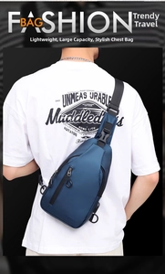 Rear view of a navy blue waterproof chest bag with adjustable nylon straps and buckle