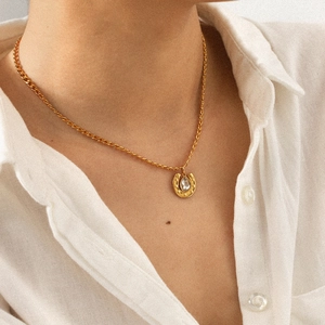 18k gold plated stainless steel horseshoe pendant necklace with cubic zirconia on model