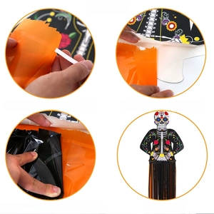 DIY Day of the Dead flower skull hanging decoration with colorful tinsel tassels