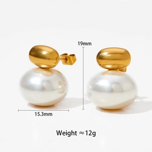 Detail view of large pearl stud earrings with gold plating and size measurements