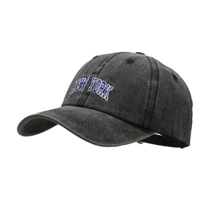 Vintage washed black baseball cap with blue New York embroidery and distressed denim finish