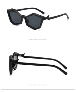Detailed close-up of matte black geometric sunglasses with jagged hinge design