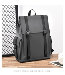 Detail of dark gray business casual backpack with waterproof fabric and buckle closures