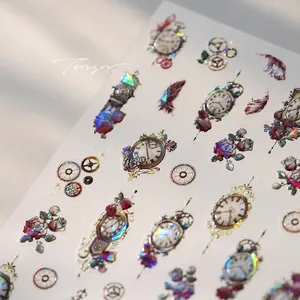 Macro detail of holographic vintage clock and gear nail art stickers with embossed texture