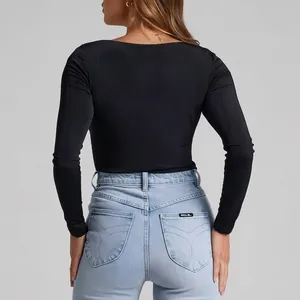Slim fit black long sleeve yoga top with backless design and stretchy fabric