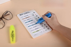 Detailed view of DIY white plastic RV checklist memo board with 10 sliding task markers