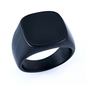 Detailed macro view of black square signet ring featuring a brushed matte stainless steel finish