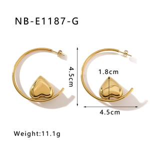 Detail view of 18K gold plated C-shaped earrings with 4.5cm diameter heart pendant