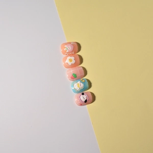 Detail of cute cartoon nail art stickers with peach, flowers, and puppy patterns