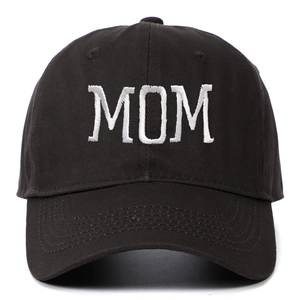 Close-up of white 'MOM' embroidery on a premium black cotton twill baseball cap