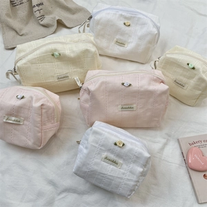 Lace cosmetic bags with 3D rose decor in pink, beige, and white, showing multiple sizes