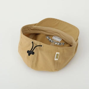 Detail of adjustable drawstring closure and canvas texture on khaki kids beret hat