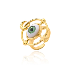 Detail view of gold evil eye adjustable ring featuring celestial moon and star accents