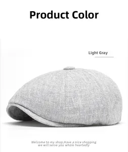 Close-up of light gray newsboy cap showing detailed linen texture and top button