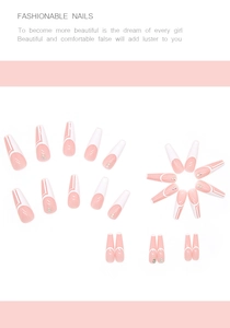 Detail of pink and white French coffin press-on nails with small diamond accents
