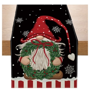 Detailed view of Christmas table runner with gnome pattern on wooden table
