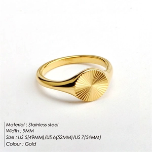 Detail showing the sunburst texture and golden finish of the 9mm stainless steel ring
